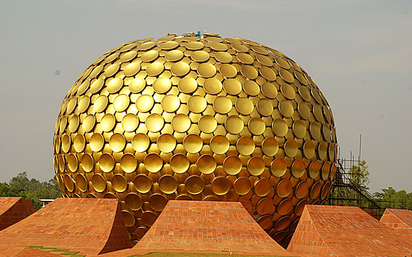 A uroville - a golden metallic sphere